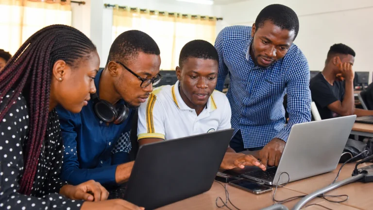 Cameroonian application development students building and testing software together